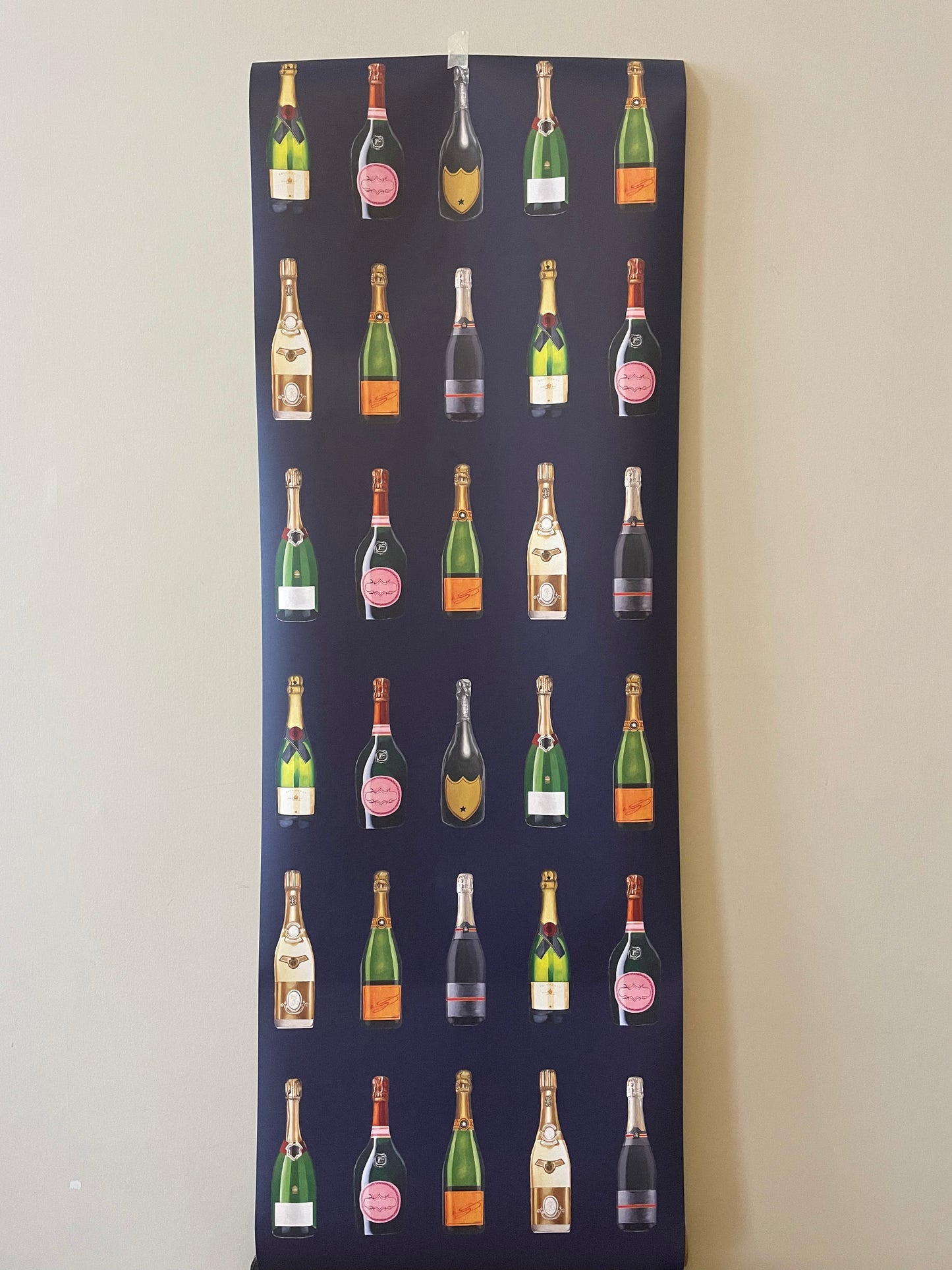 Fabric panel with repeated pattern of wine bottles on a dark background