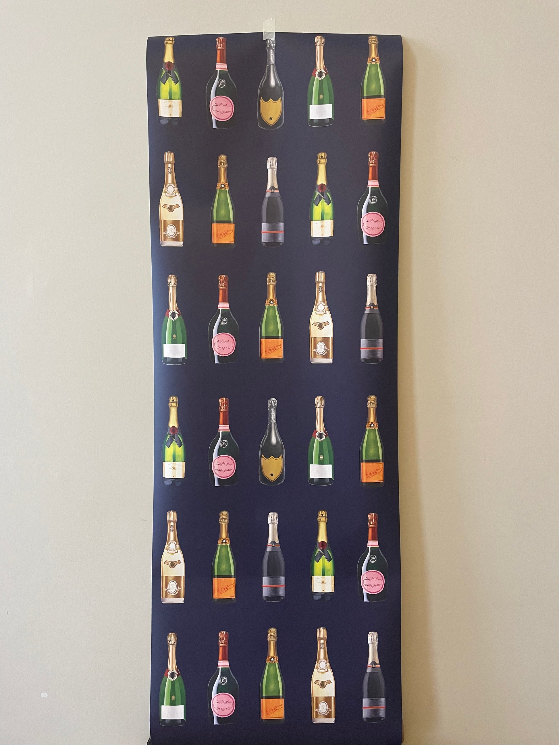 Fabric panel with repeated pattern of wine bottles on a dark background