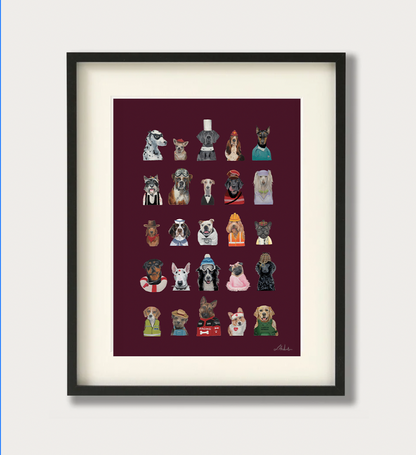 A framed art print featuring a grid of 30 different dog illustrations in various costumes, set against a dark burgundy background with a white mat and a black frame.