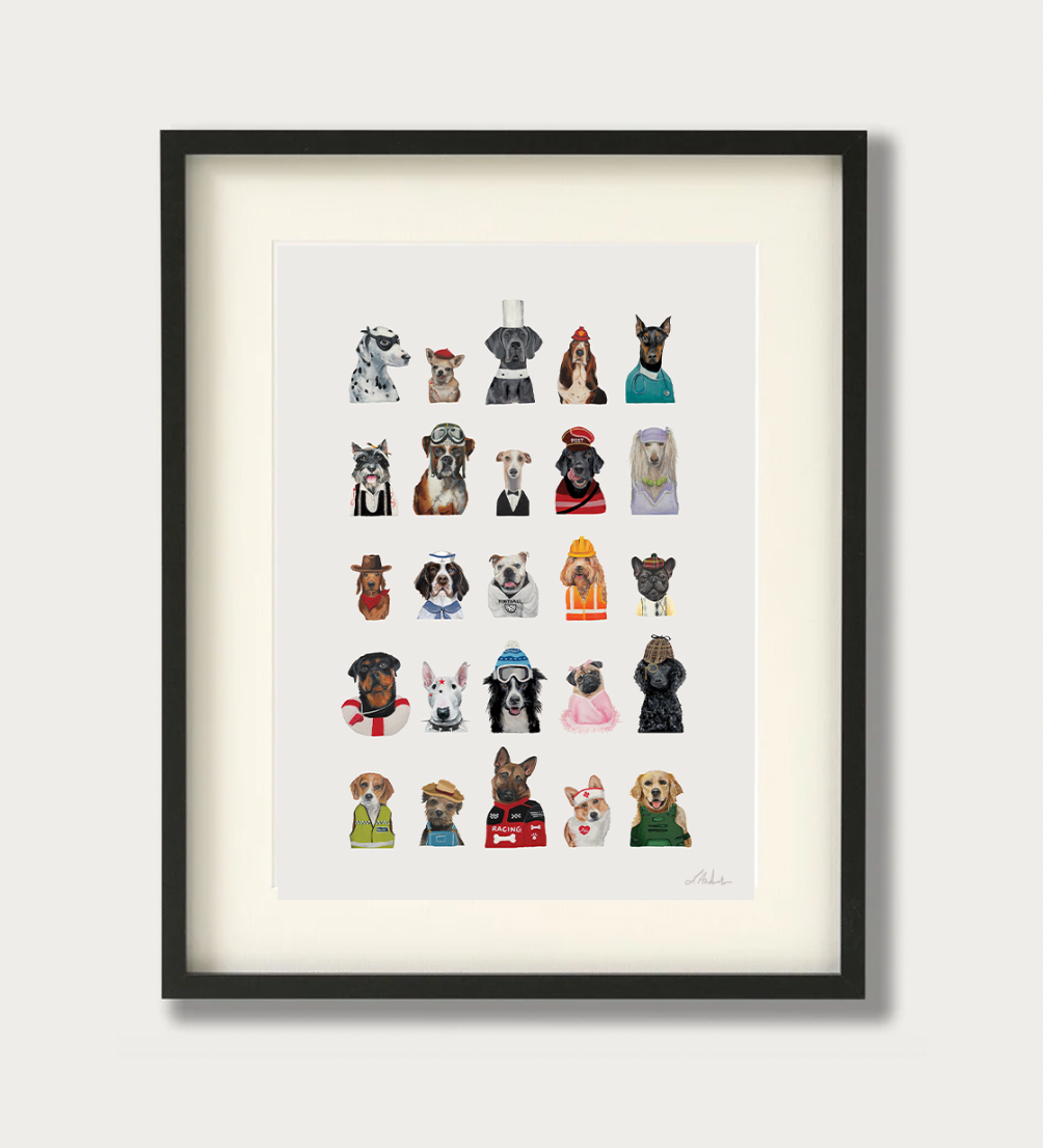 Framed wall art featuring a grid of small illustrated dog portraits in various outfits, shown in a black frame with a white mat against a light neutral background.