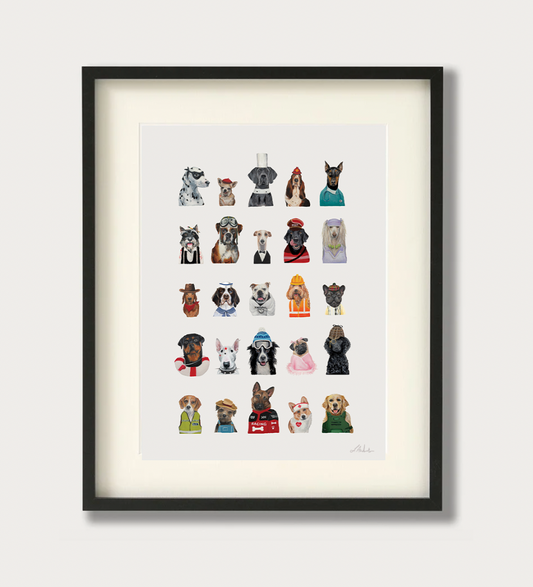 Framed wall art featuring a grid of small illustrated dog portraits in various outfits, shown in a black frame with a white mat against a light neutral background.