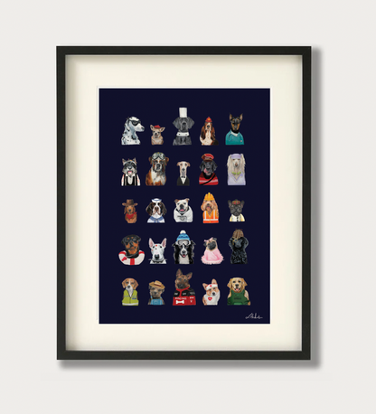 Framed wall art featuring a grid of 24 illustrated dog portraits in various outfits on a dark navy background, shown in a black frame with a white mat against a light gray wall.